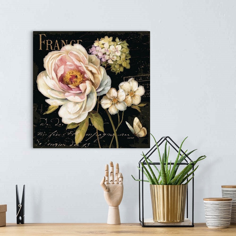 A bohemian room featuring Painting of floral bouquet with fancy script text in background.