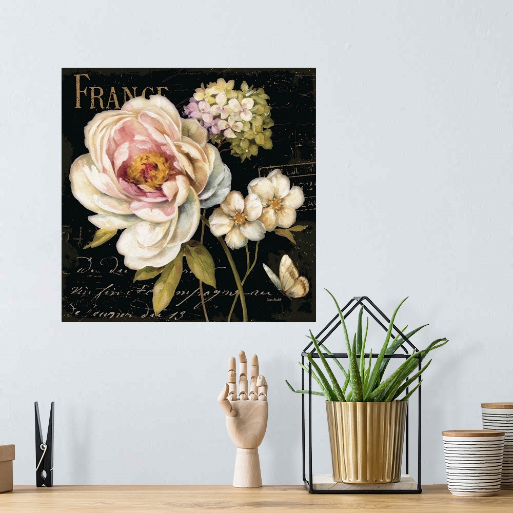 A bohemian room featuring Painting of floral bouquet with fancy script text in background.