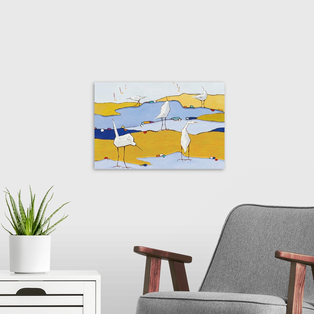 A modern room featuring Abstract painting of five white egrets in a marsh made out of a variety of blue and yellow hues.