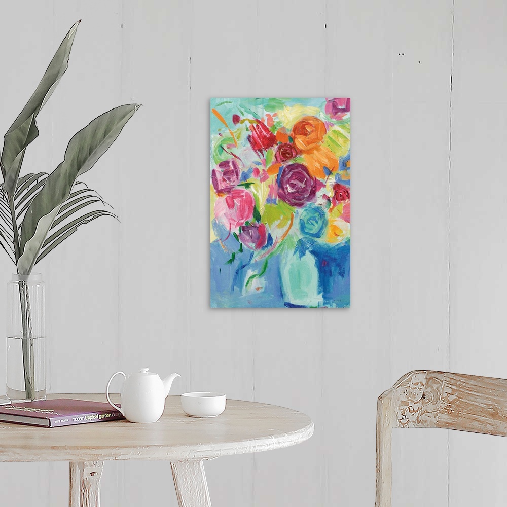 A farmhouse room featuring Impressionist painting of pastel colored florals in an aqua vase.