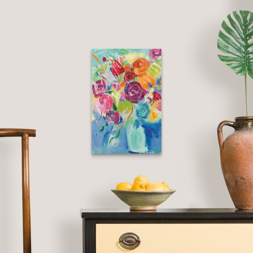 A traditional room featuring Impressionist painting of pastel colored florals in an aqua vase.
