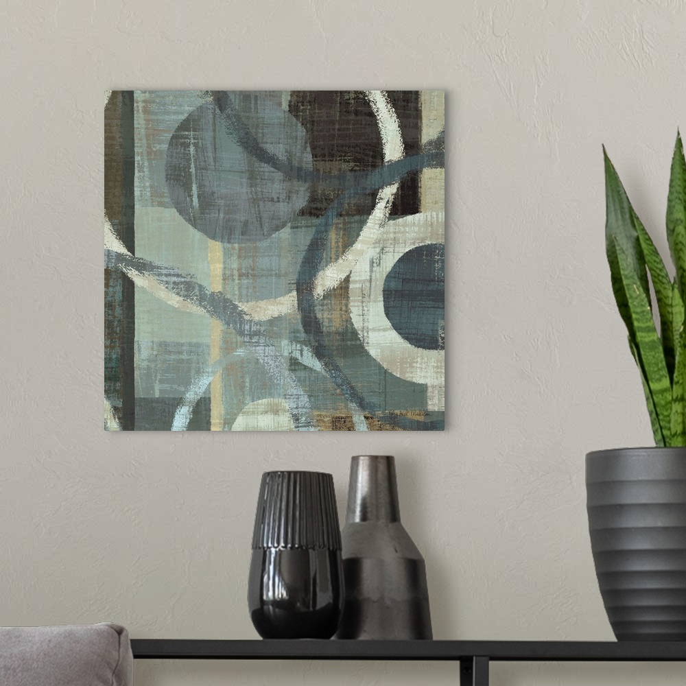 A modern room featuring Abstract painting with circles of different sizes against a background of cool toned brush strokes.