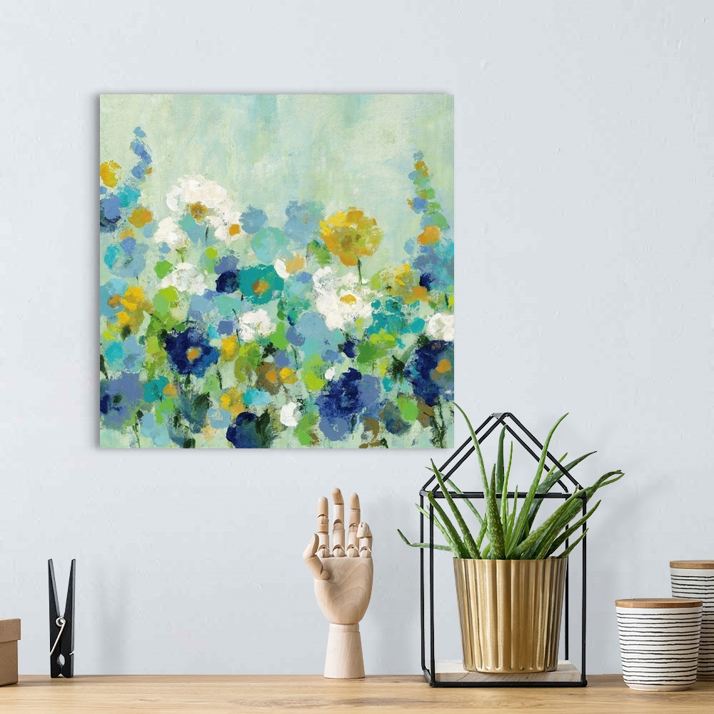 A bohemian room featuring A square painting of multi-colored blooming flowers in a garden.