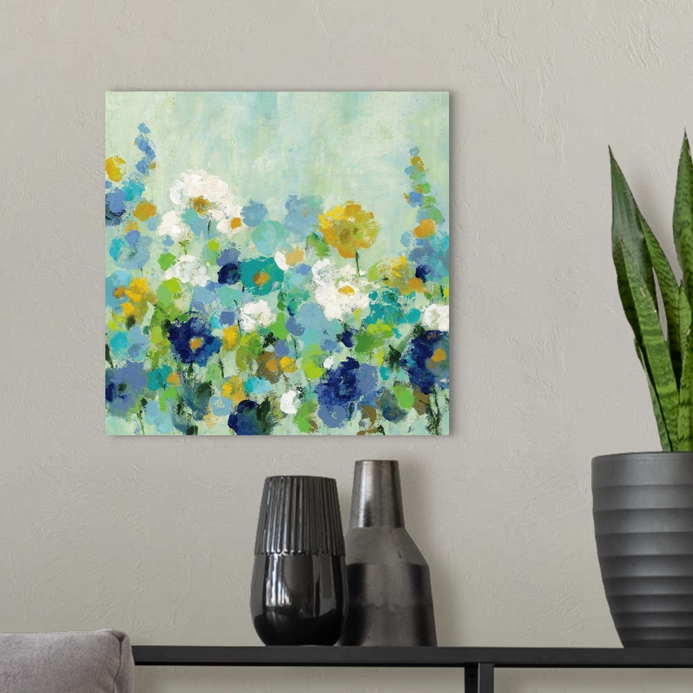 A modern room featuring A square painting of multi-colored blooming flowers in a garden.
