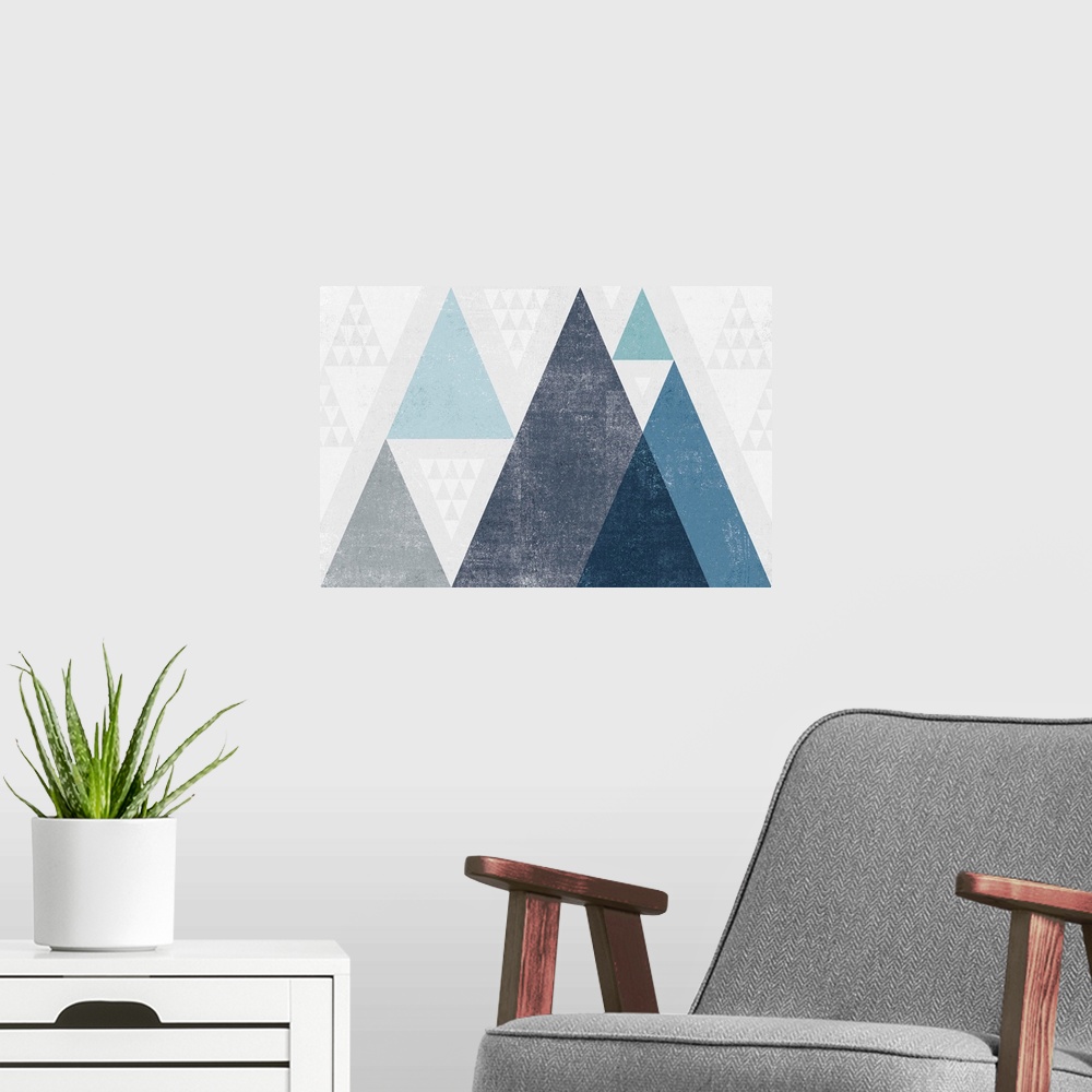 A modern room featuring Abstract geometric artwork of a triangle design in cool blue.