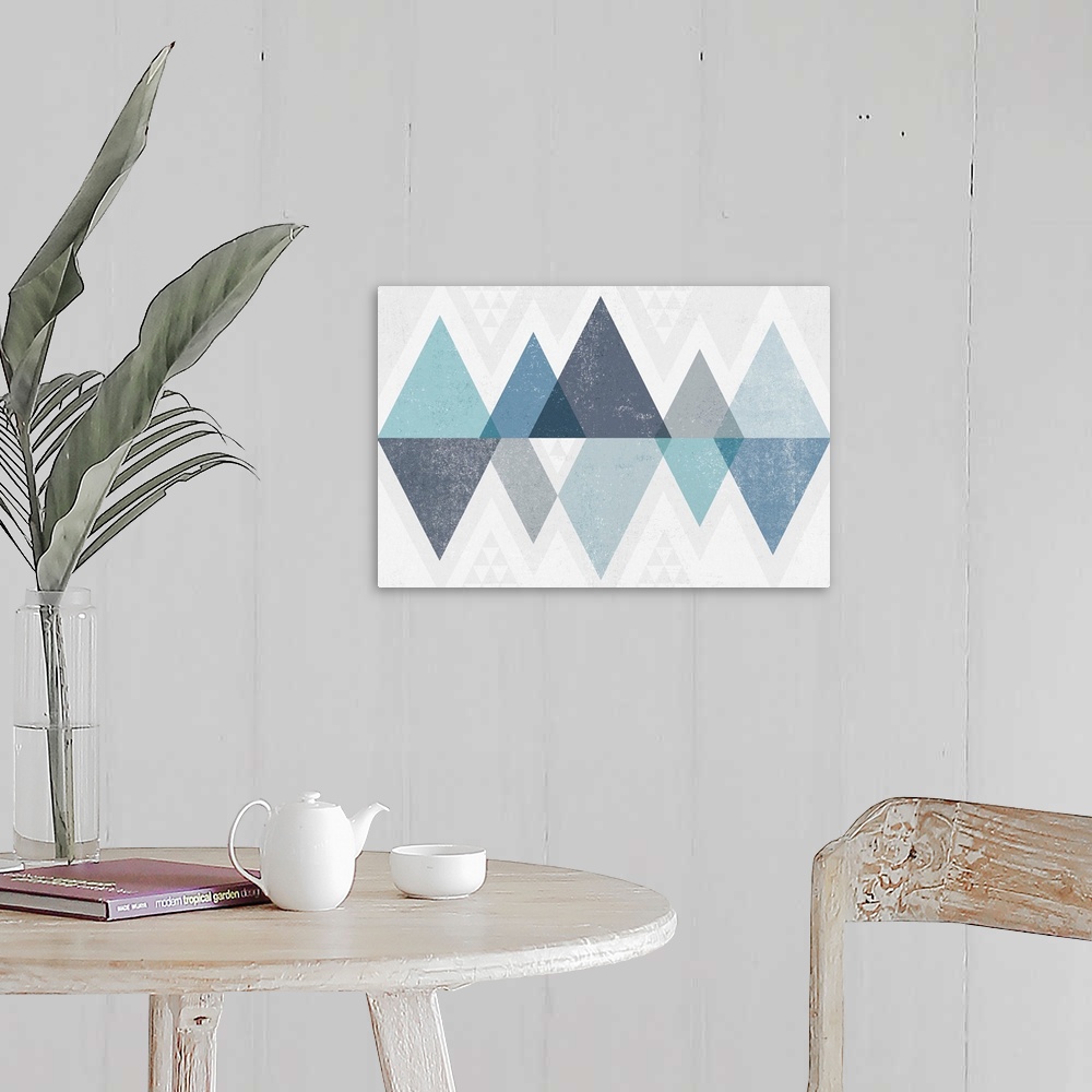 A farmhouse room featuring Abstract geometric artwork of a triangle design in cool blue.