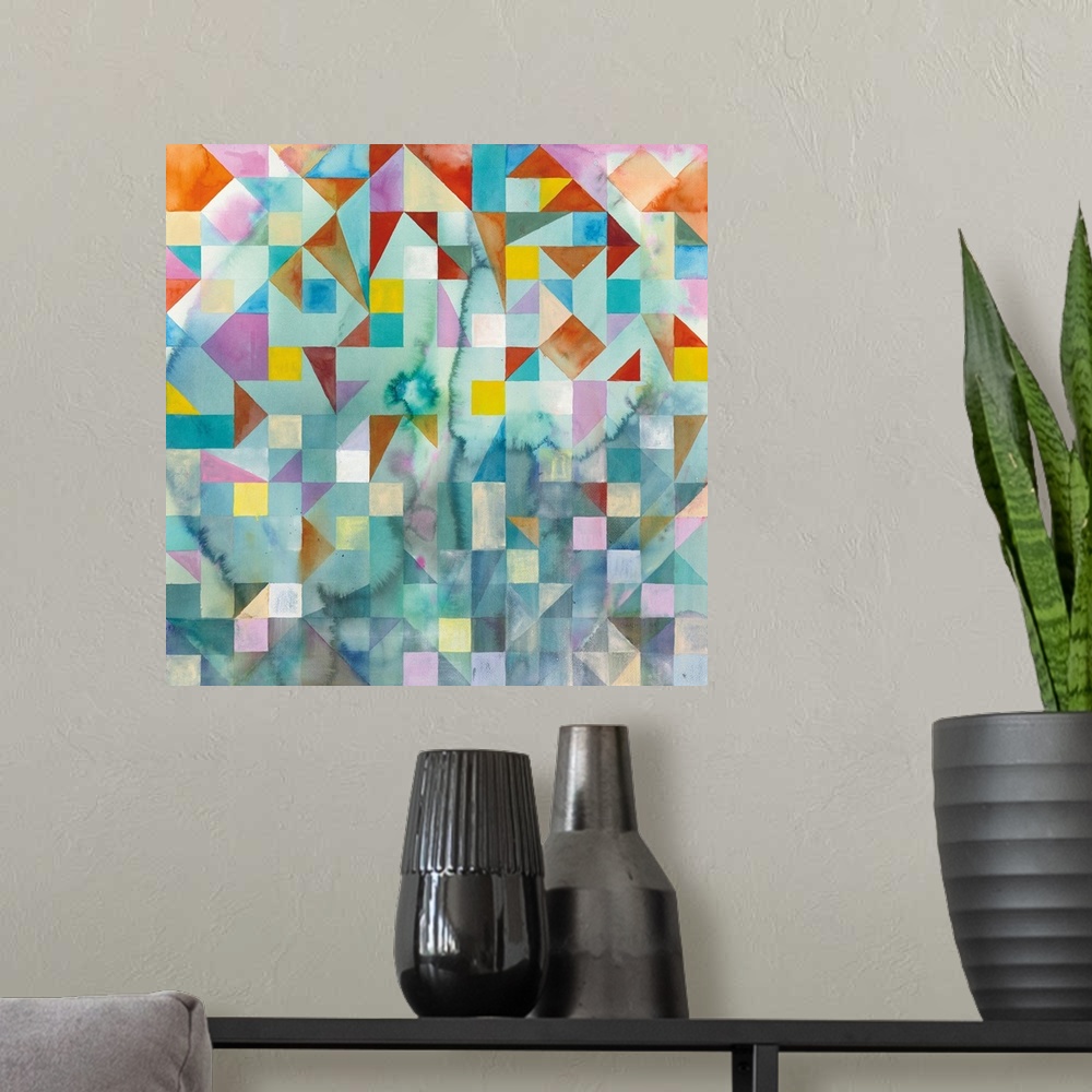 A modern room featuring Abstract artwork with colorful patchwork with geometric shapes on a square canvas.