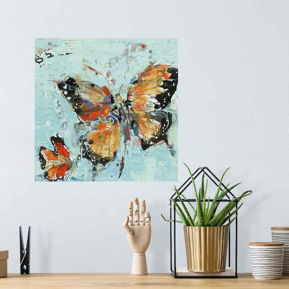 A bohemian room featuring Two orange butterflies on a sky blue background made with mixed media.