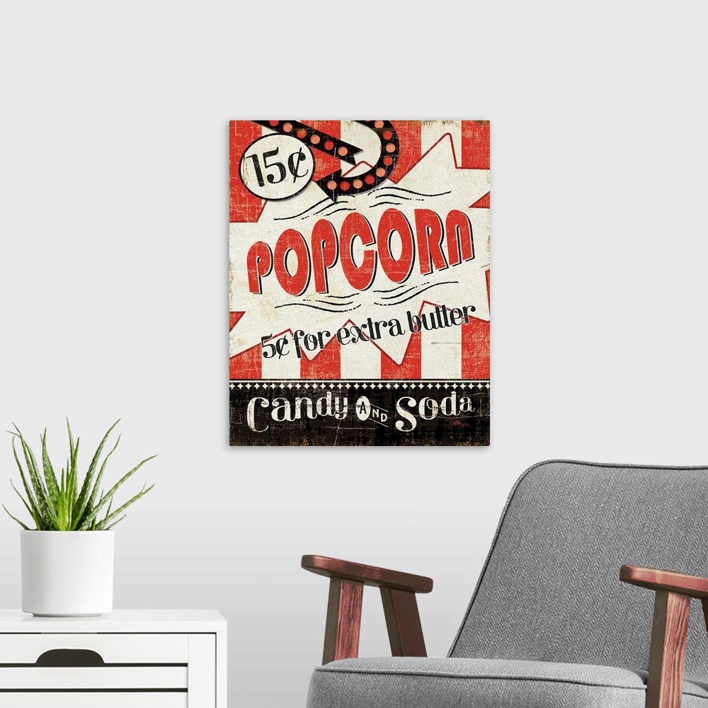 A modern room featuring Canvas print of a vintage advertisement for popcorn and candy.