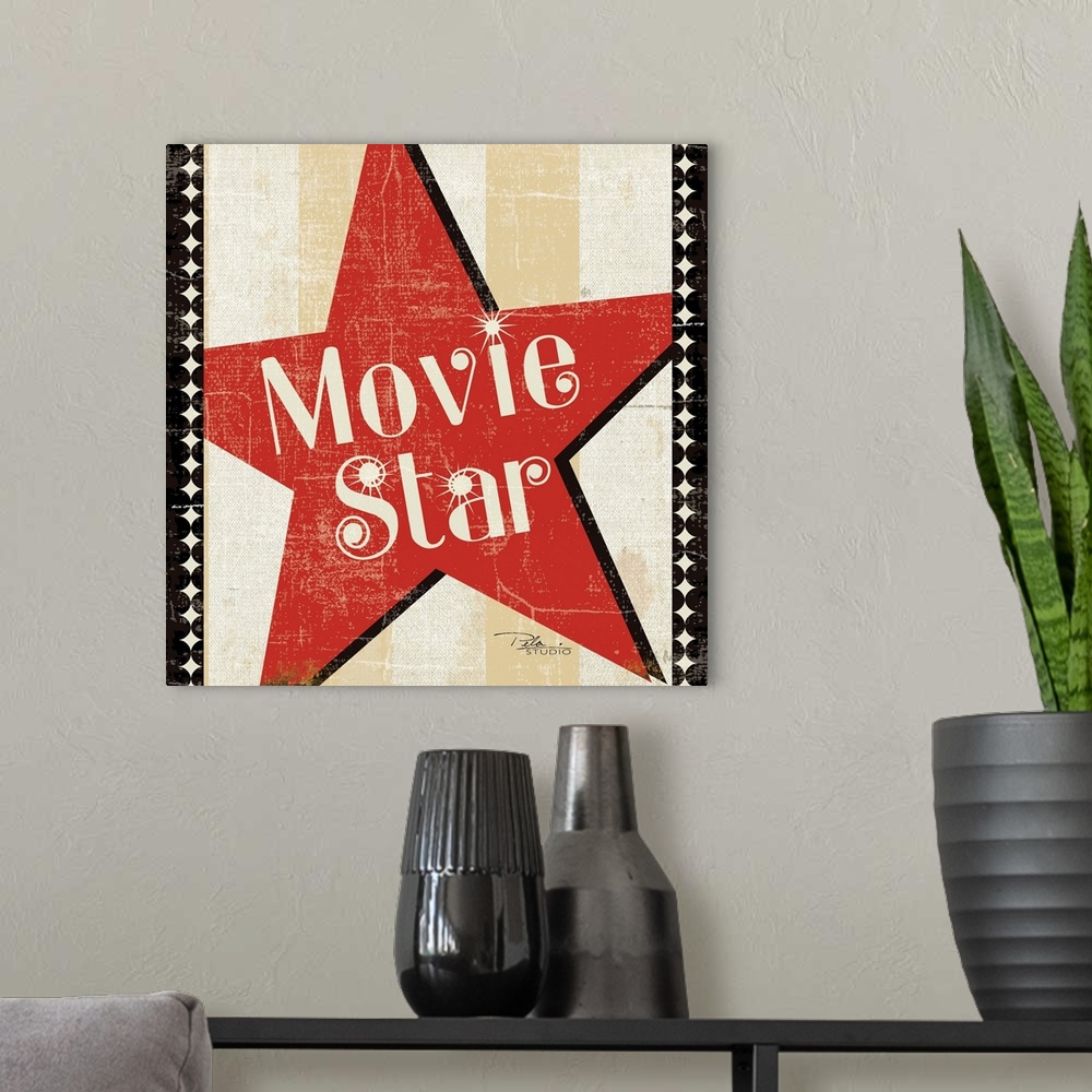 A modern room featuring Contemporary artwork of a Hollywood star icon in red with text in the center of it.