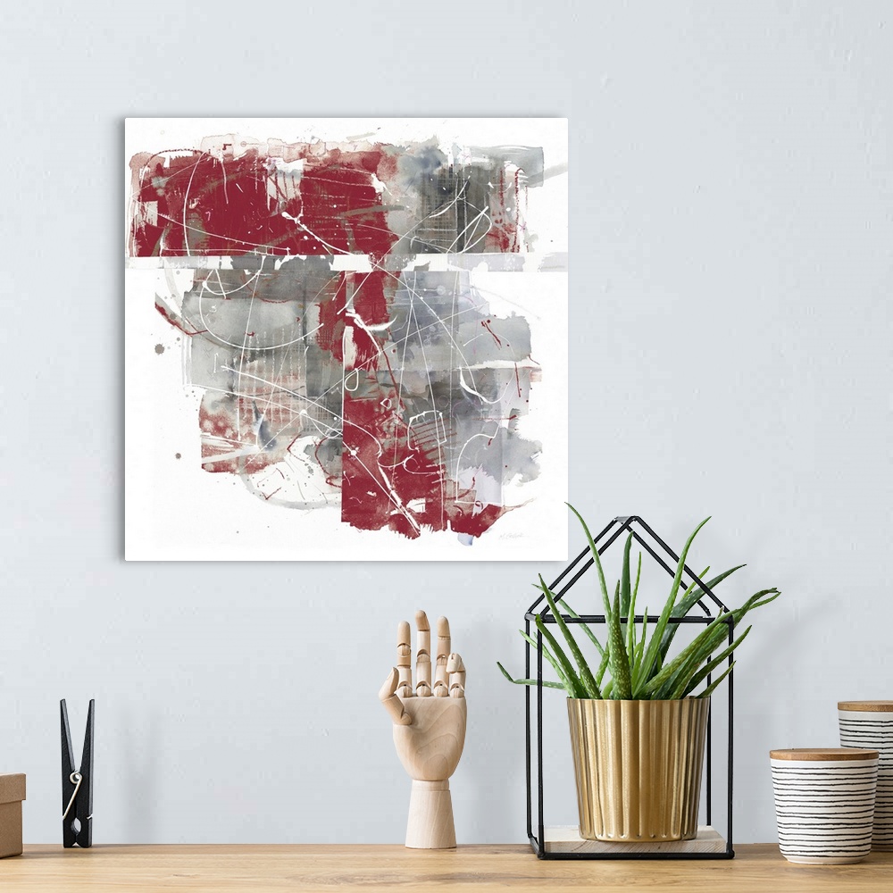 A bohemian room featuring Square abstract painting using grey and red hues with thin, white lines all over the top.