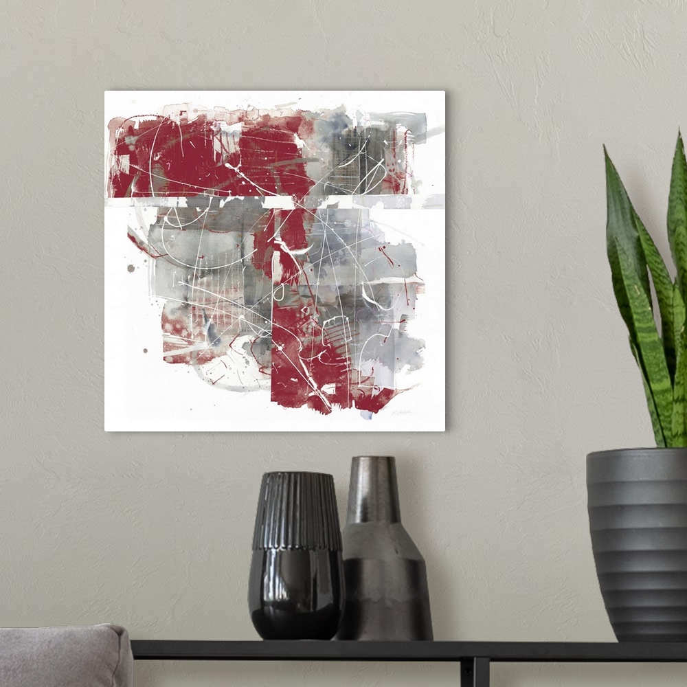 A modern room featuring Square abstract painting using grey and red hues with thin, white lines all over the top.