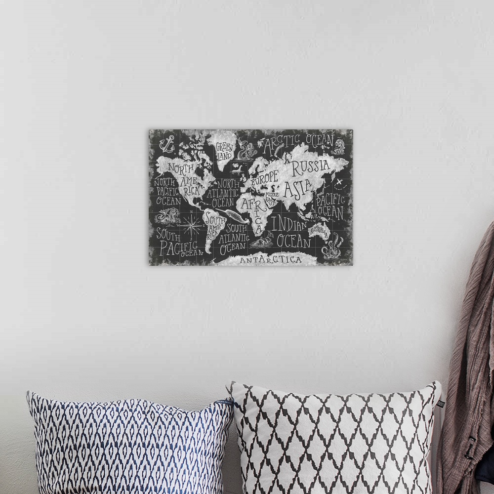 A bohemian room featuring Chalkboard map of the world with mythical creatures decorating the oceans.