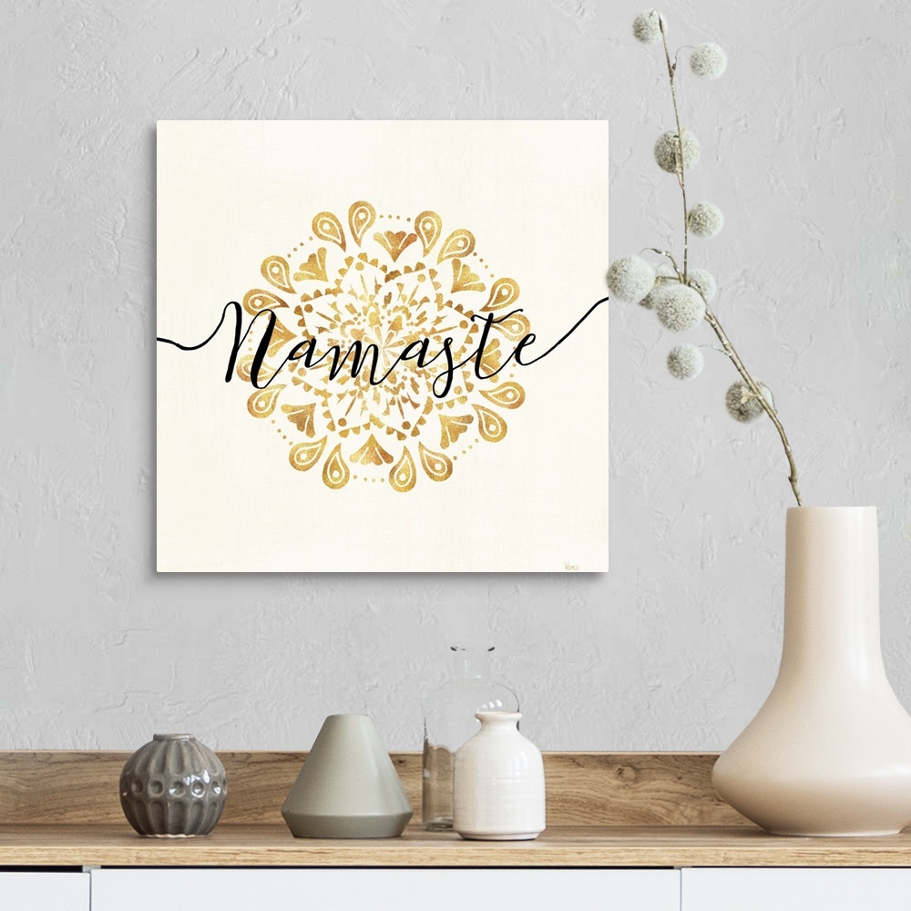 A farmhouse room featuring Shiny gold mandala on a neutral background with the word "Namaste" written through the center.