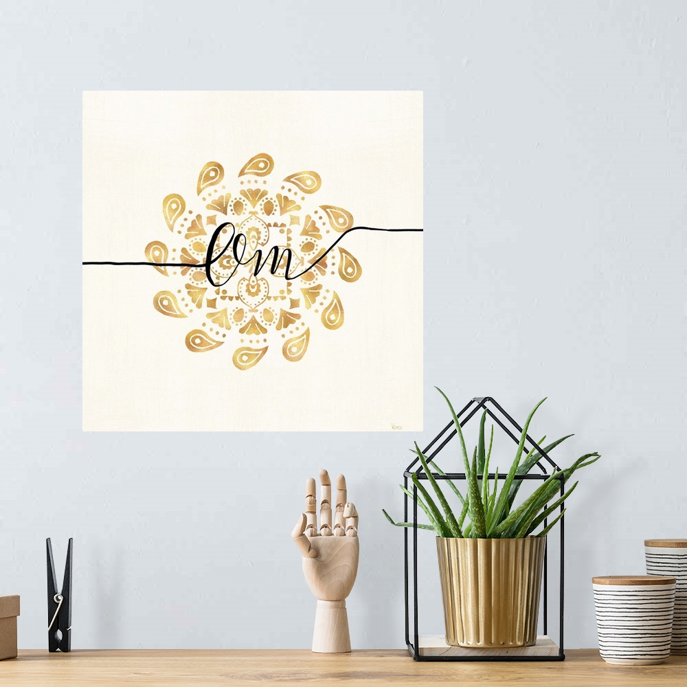 A bohemian room featuring Shiny gold mandala on a neutral background with the word "Om" written through the center.
