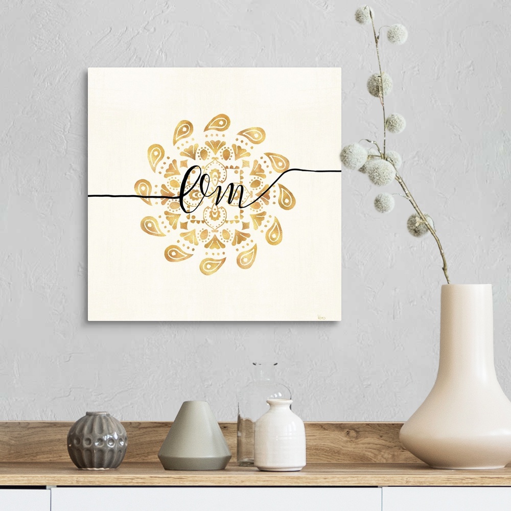 A farmhouse room featuring Shiny gold mandala on a neutral background with the word "Om" written through the center.