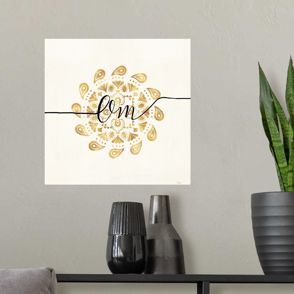 A modern room featuring Shiny gold mandala on a neutral background with the word "Om" written through the center.