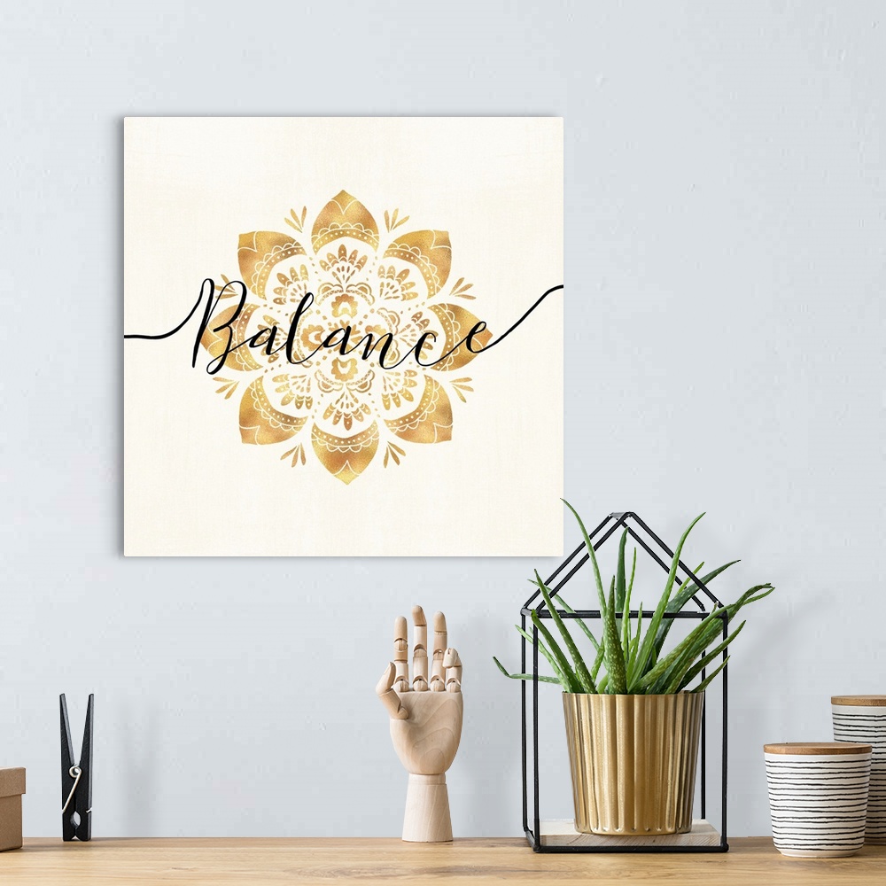 A bohemian room featuring Shiny gold mandala on a neutral background with the word "Balance" written through the center.