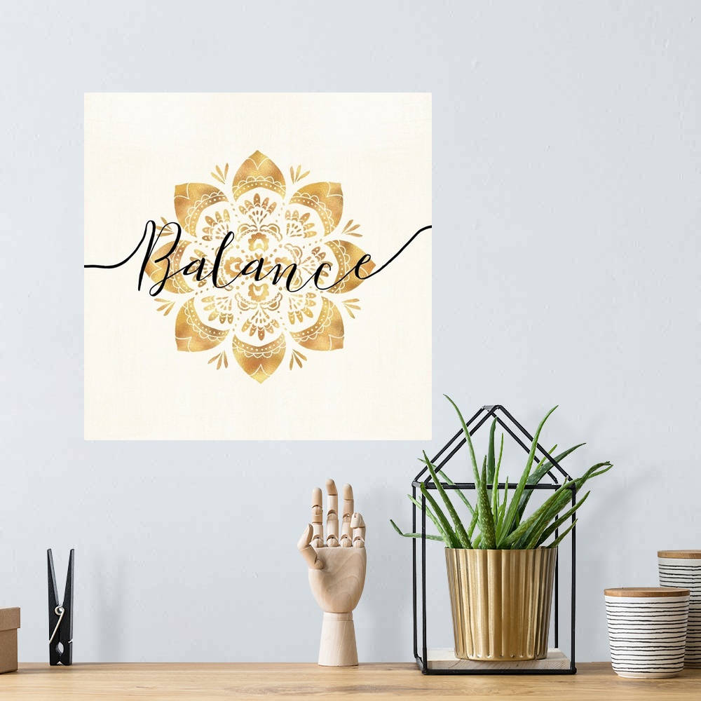 A bohemian room featuring Shiny gold mandala on a neutral background with the word "Balance" written through the center.