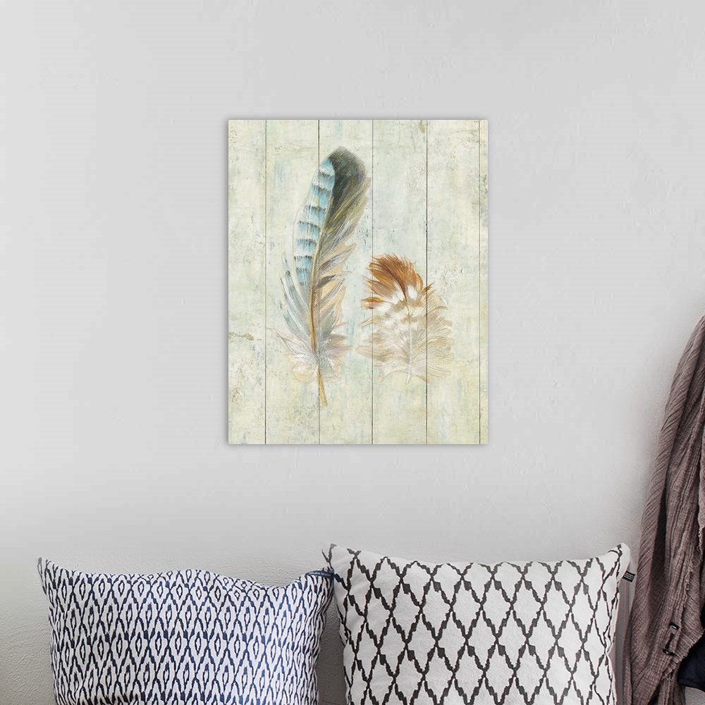 A bohemian room featuring Artwork of soft looking decorative feathers against a rustic wooden background.