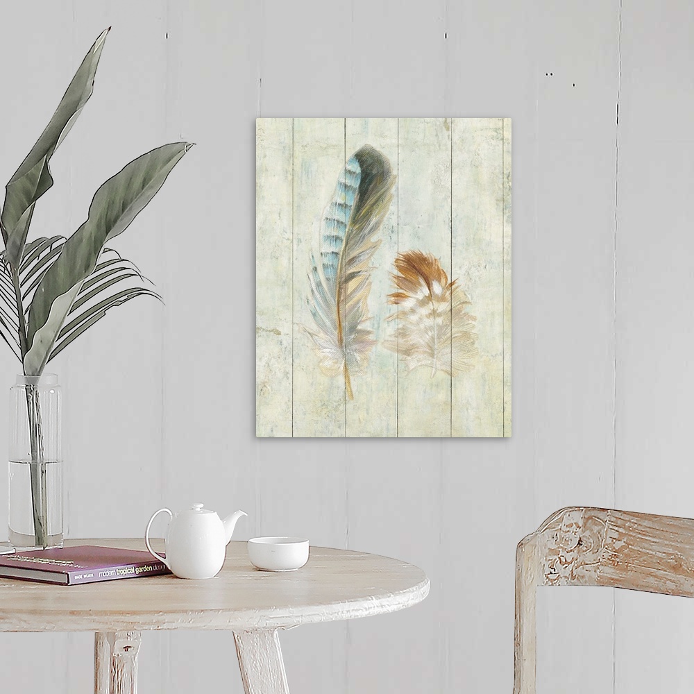 A farmhouse room featuring Artwork of soft looking decorative feathers against a rustic wooden background.