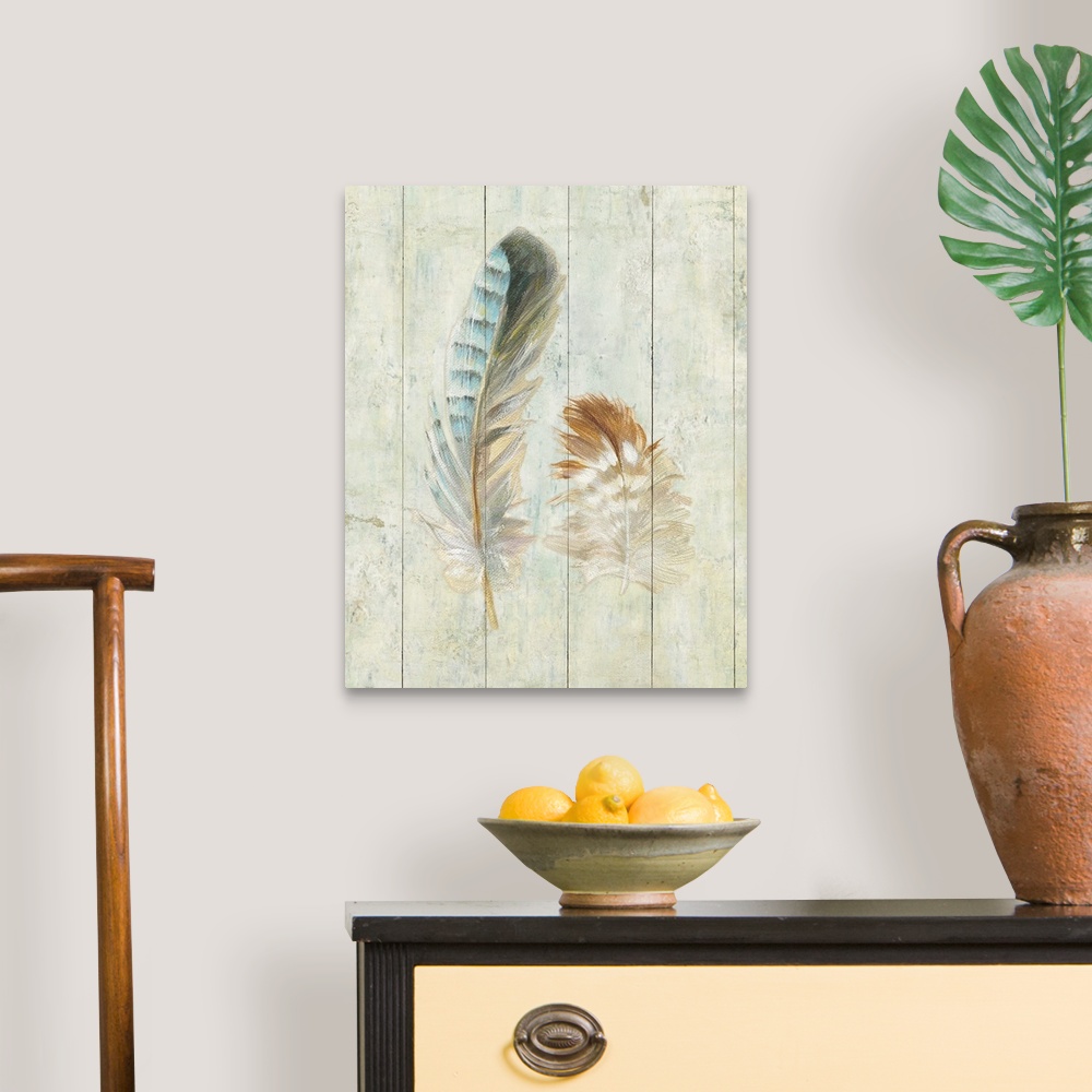A traditional room featuring Artwork of soft looking decorative feathers against a rustic wooden background.