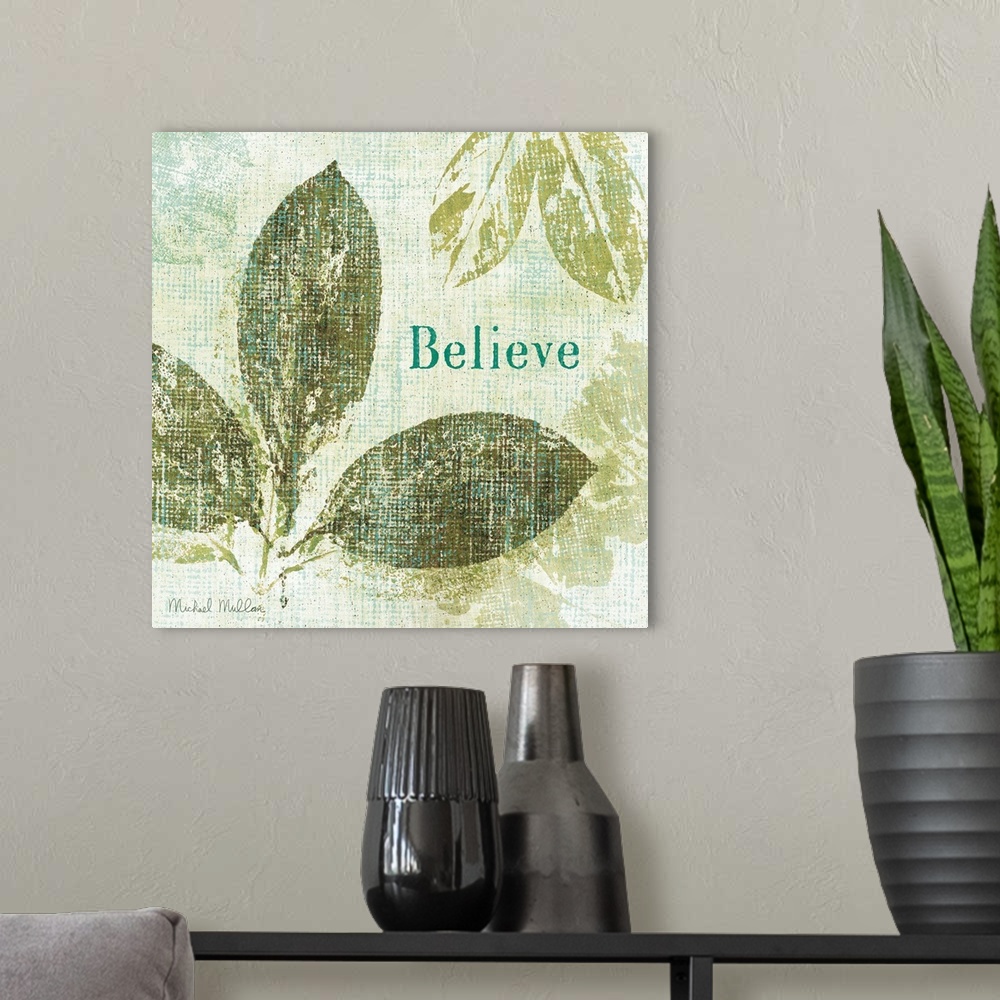 A modern room featuring Contemporary artwork of different types of leaves with the word "Believe" to the right of the image.