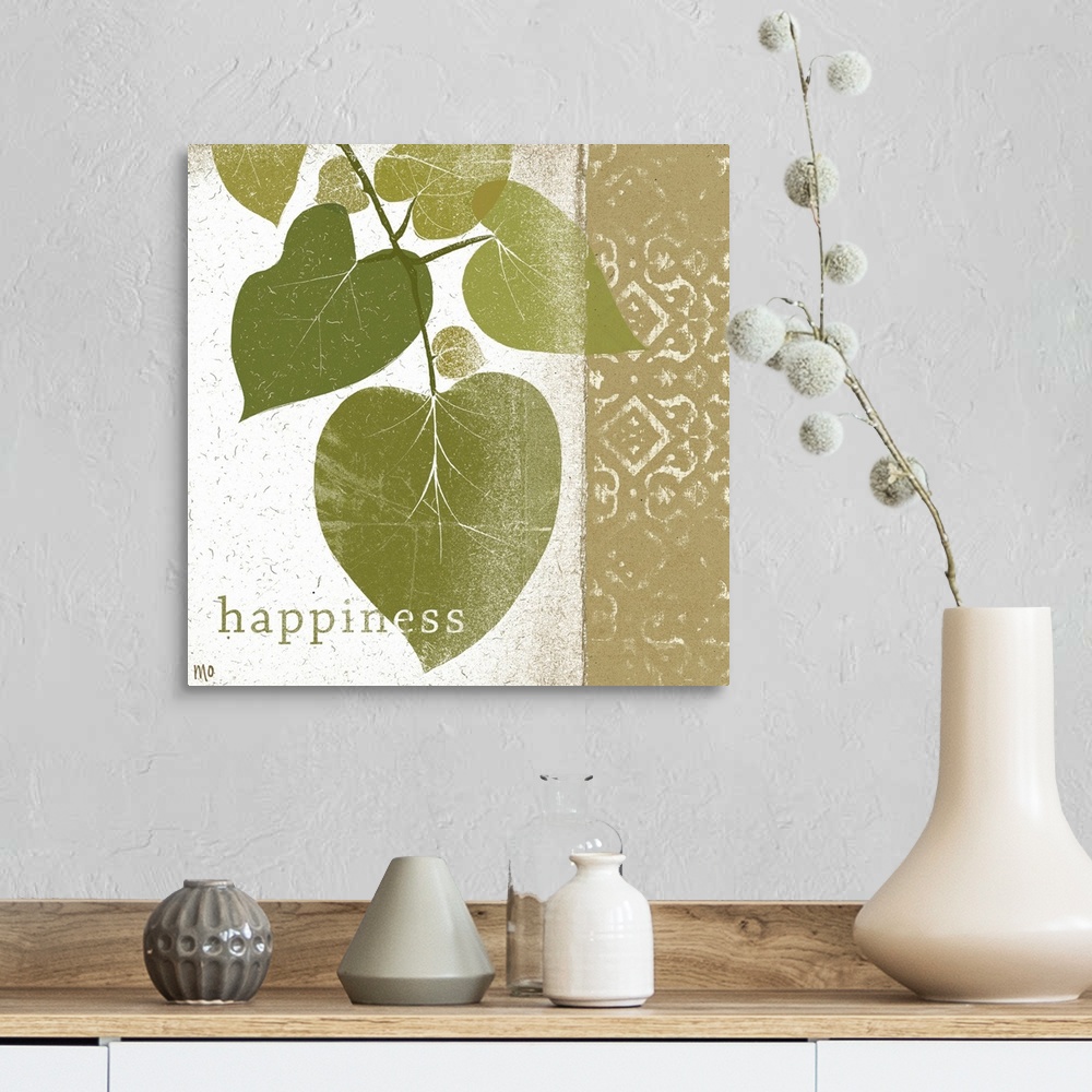 A farmhouse room featuring Photo of a branch of leaves and a design with the word happiness at the bottom.