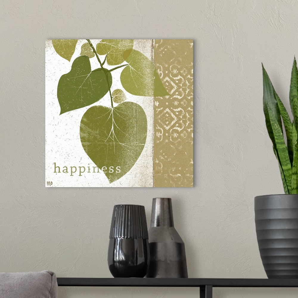 A modern room featuring Photo of a branch of leaves and a design with the word happiness at the bottom.