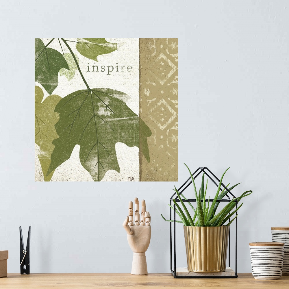 A bohemian room featuring Textured leaves on a patterned background with the word inspire towards the top.