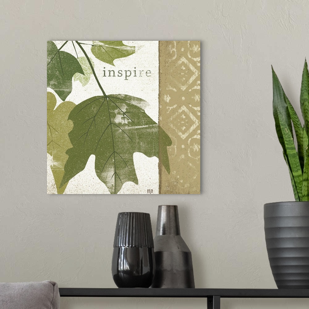 A modern room featuring Textured leaves on a patterned background with the word inspire towards the top.