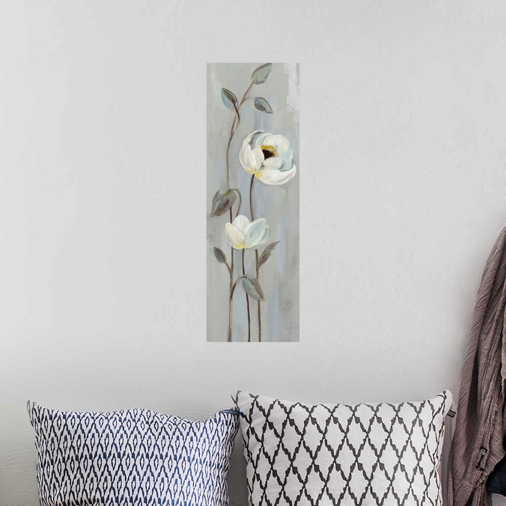 A bohemian room featuring Tall cool toned painting of white flowers with long, thin stems on a grey background.