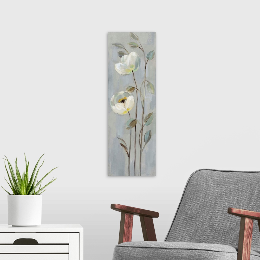 A modern room featuring Tall cool toned painting of white flowers with long, thin stems on a grey background.