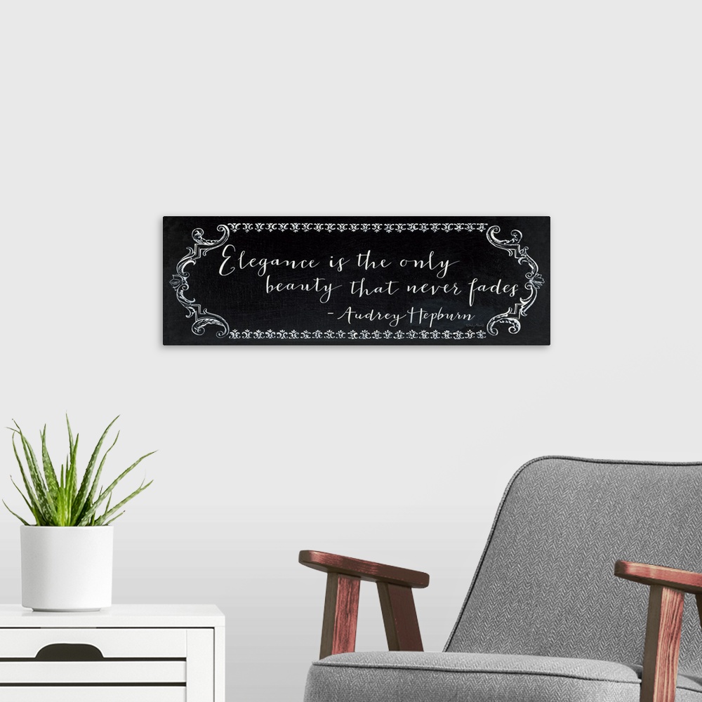 A modern room featuring Horizontal, large wall hanging of white script text that reads "Elegance is the only beauty that ...