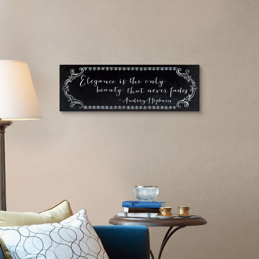 A traditional room featuring Horizontal, large wall hanging of white script text that reads "Elegance is the only beauty that ...
