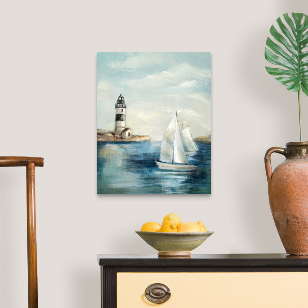 A traditional room featuring Contemporary painting of an idyllic coastal scene, with a lighthouse in the background and a sail...