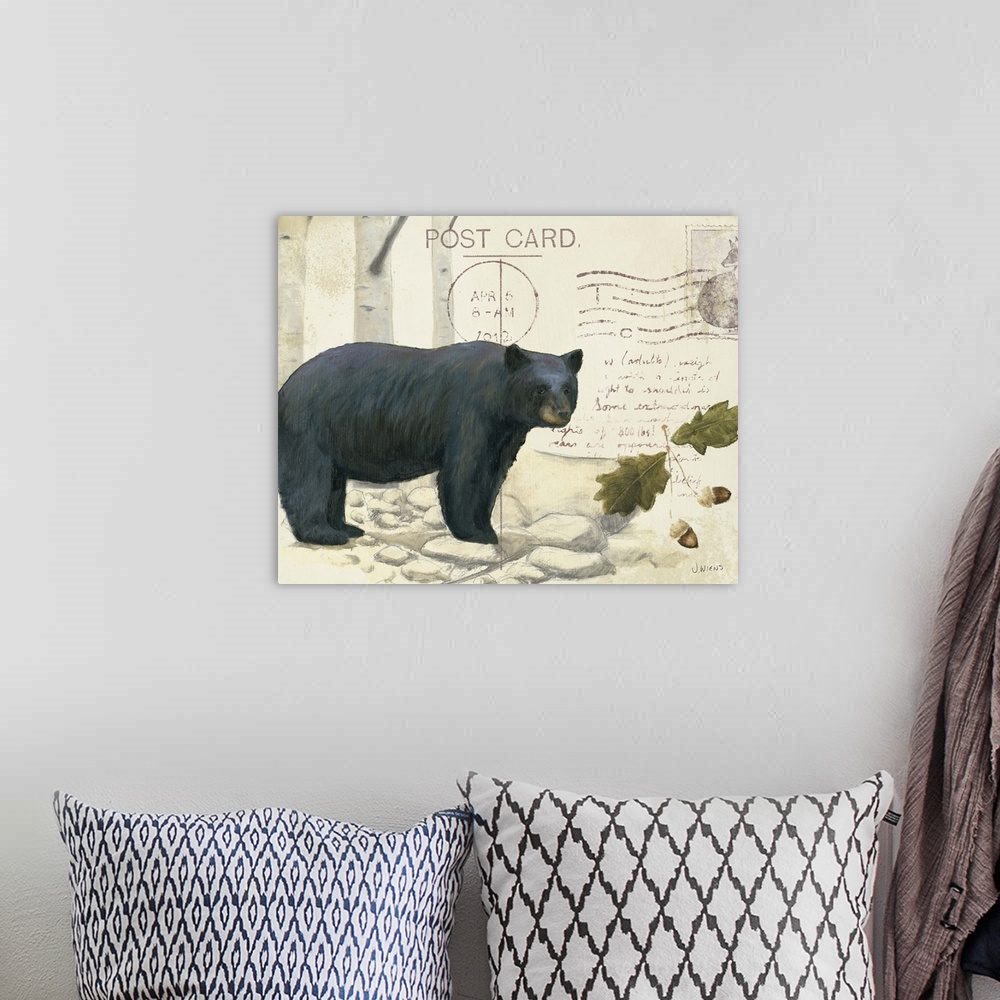 A bohemian room featuring Cabin decor of a bear and tree details on a vintage looking postcard.