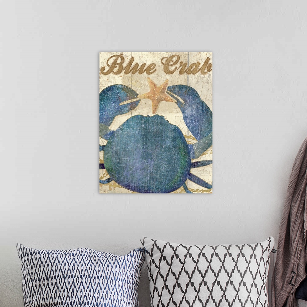 A bohemian room featuring A blue crab holding a starfish with the words "Blue Crab" written in script above it.