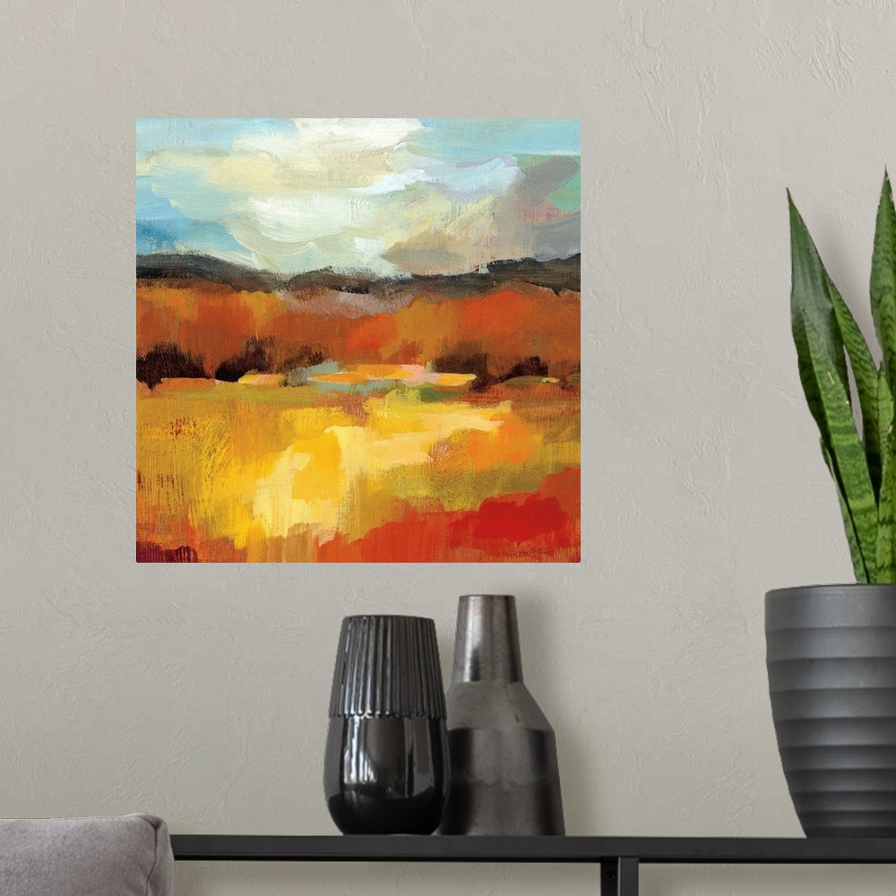 A modern room featuring Square abstract painting of an Autumn tree scene with a blue sky.