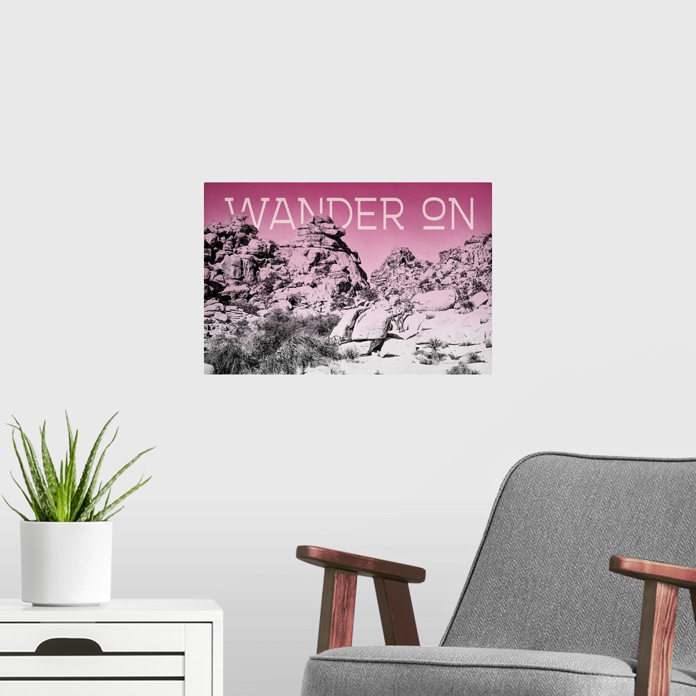 A modern room featuring "Wander On" on a horizontal rocky landscape image with a red overlay.