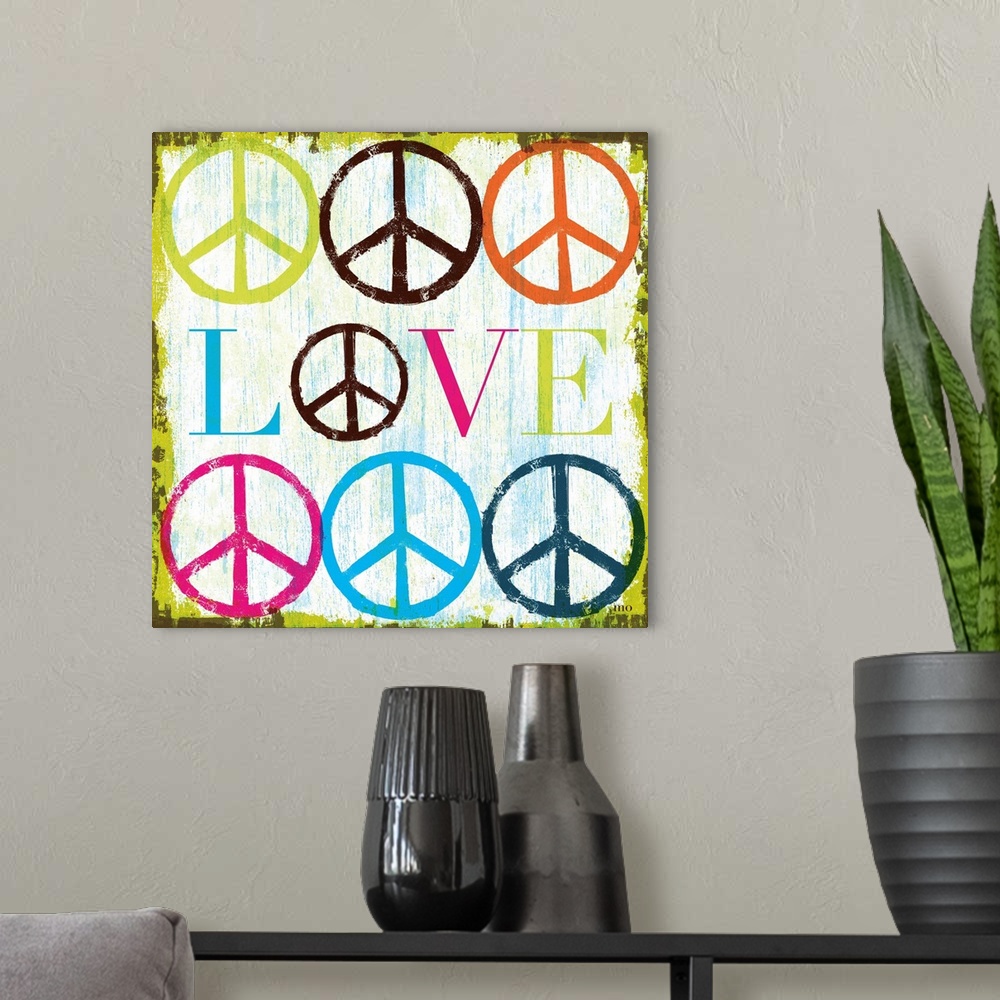 A modern room featuring Retro artwork of the word "LOVE" surrounded by colorful peace sign symbols.