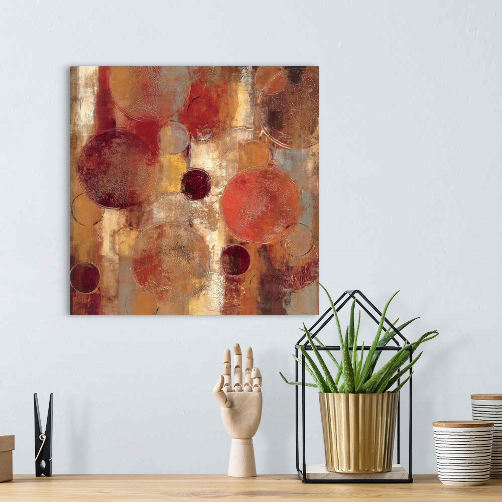 A bohemian room featuring Muted contemporary abstract painting of overlapping circles varying in size.  The background cons...