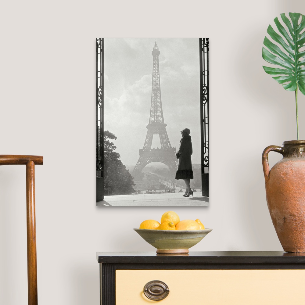A traditional room featuring Vintage photograph of a stylish woman standing in an art deco gateway with the Eiffel Tower in th...