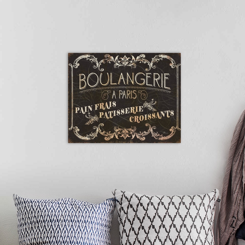A bohemian room featuring Parisian Signs