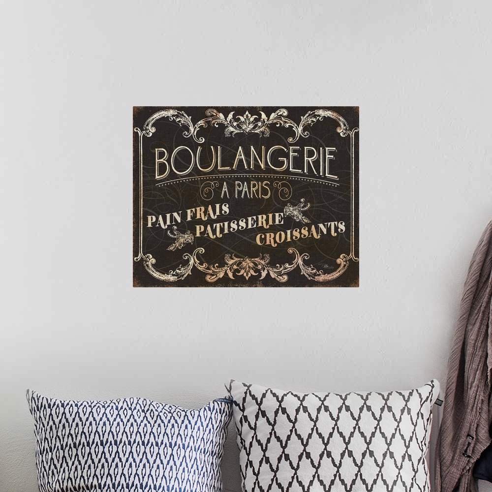 A bohemian room featuring Parisian Signs