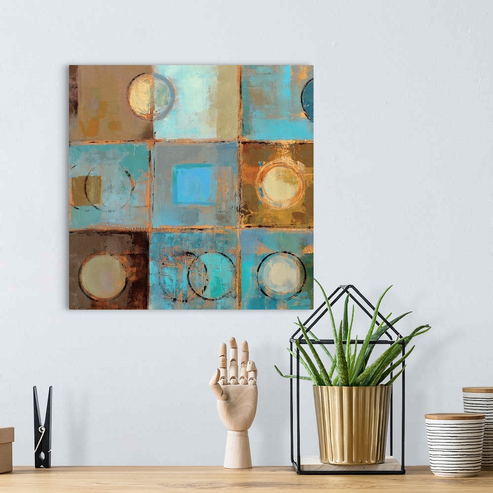 A bohemian room featuring Contemporary painting of squares and circles in cool aqua and earthy tones, separated by light ta...