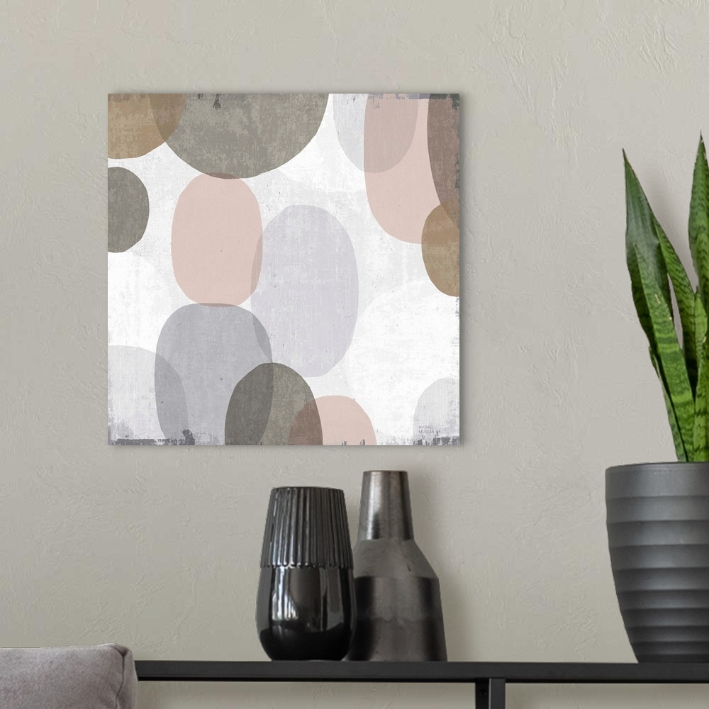 A modern room featuring Large abstract artwork with oblong shapes running down the canvas in brown, gray, faded pink, and...