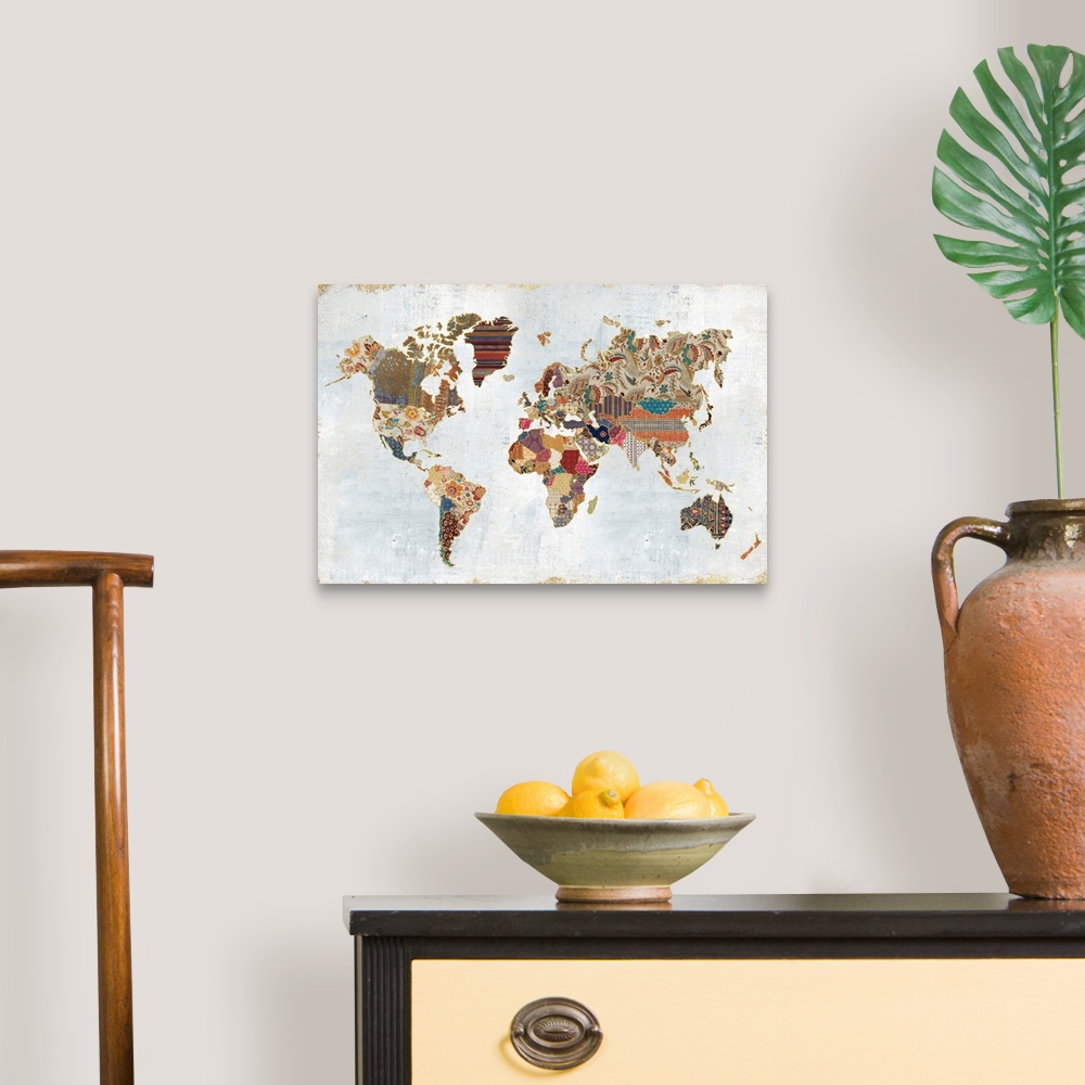 A traditional room featuring Contemporary artwork of a world map made from different patterns.