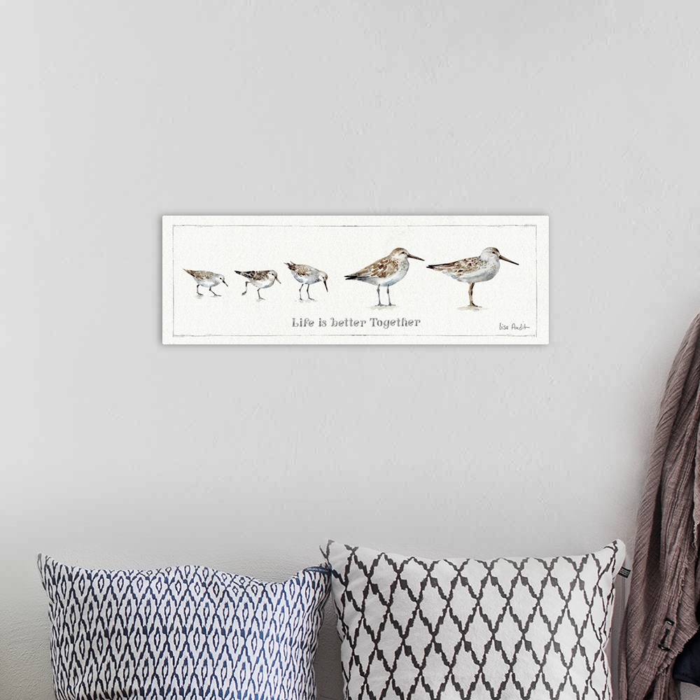 A bohemian room featuring Watercolor painting of a family of sandpipers with the phrase "Life is better together."