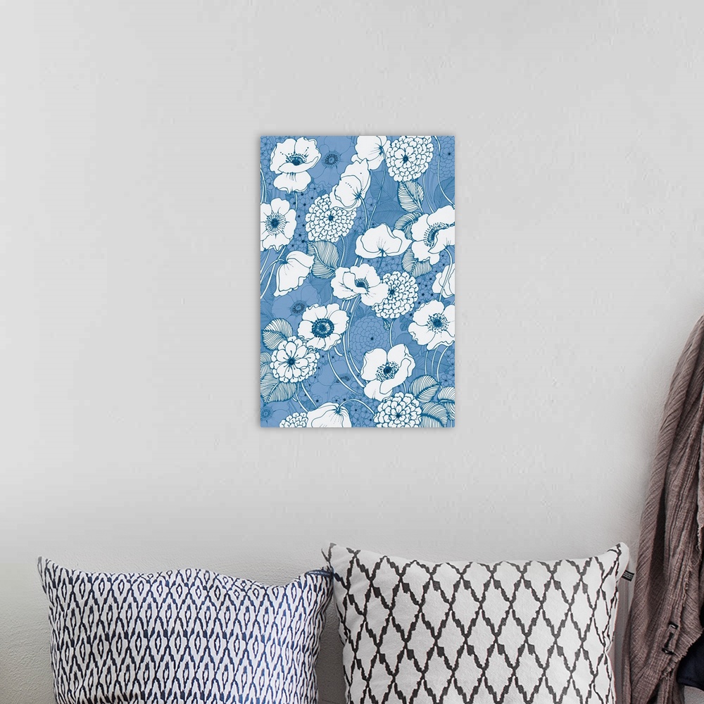 A bohemian room featuring A vertical image of white poppy flowers outlined in blue on a blue floral backdrop.